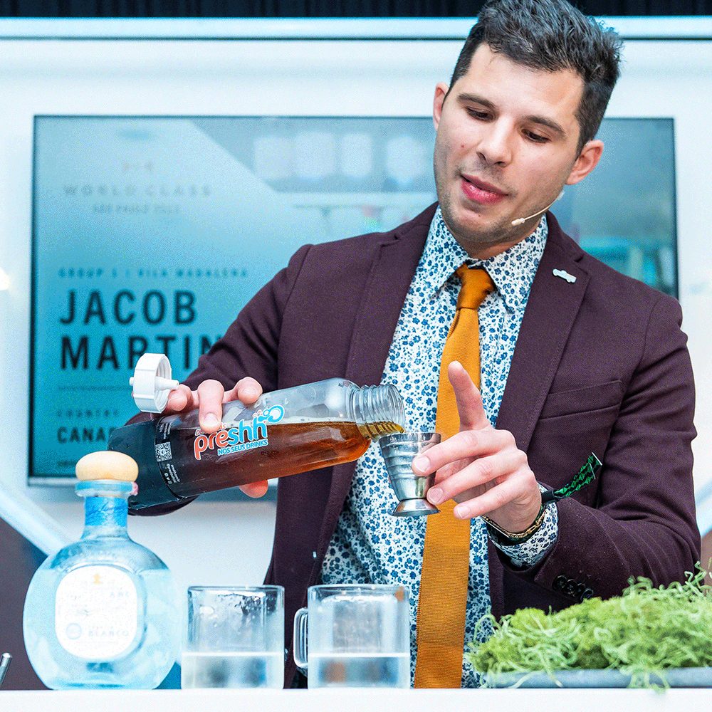 Bartenders competing on a professional cocktail competition stage
